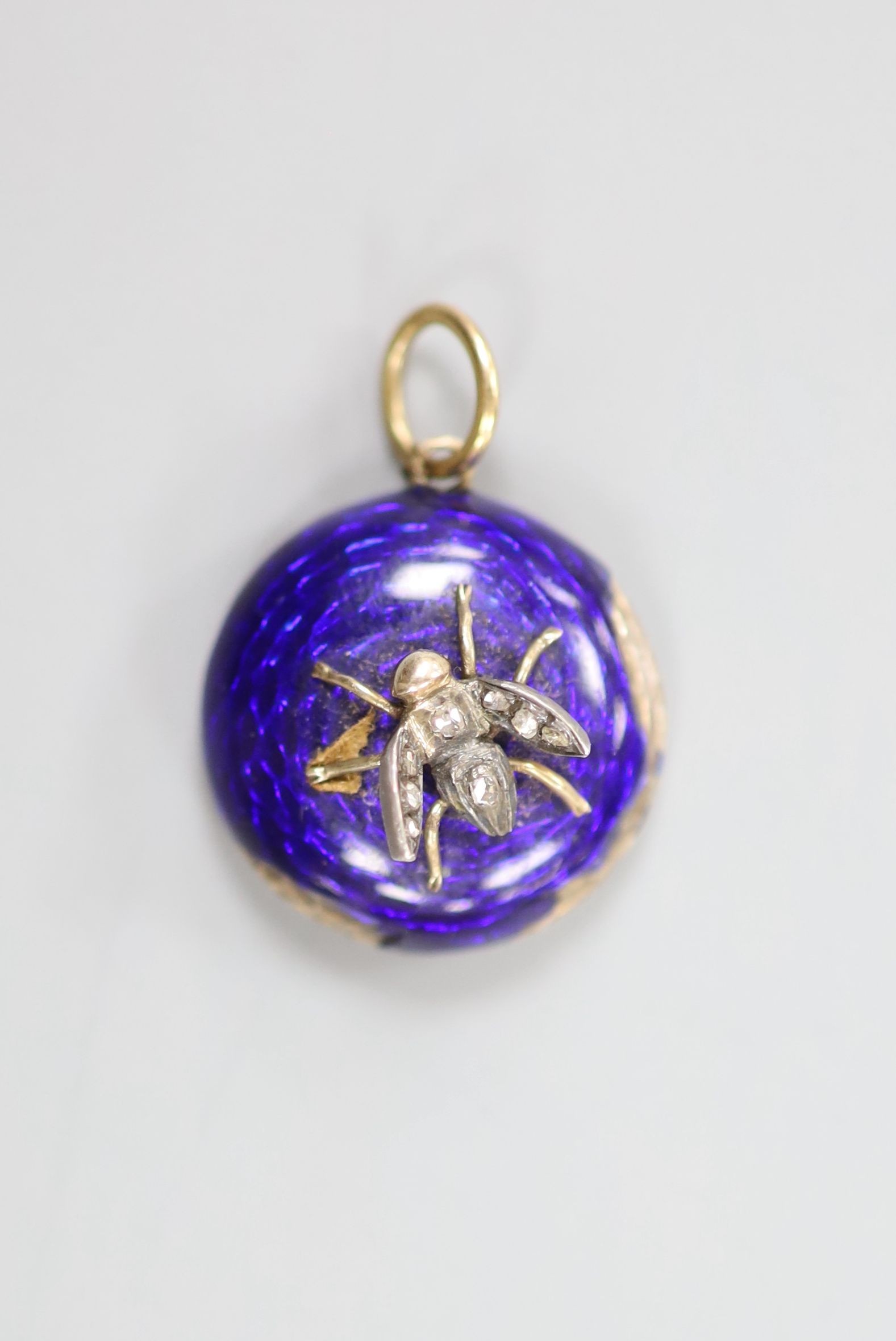 A Victorian yellow metal, blue enamel and rose cut diamond set bug pendant, with glazed back, 18mm, gross 4 grams.